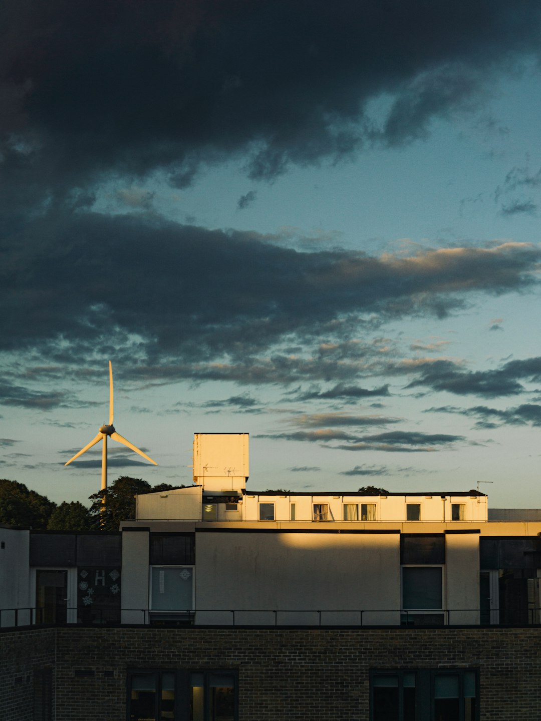 Windmill at Lancaster University, with afterglows shining on the building structure